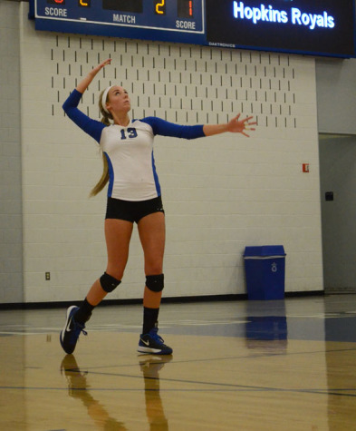 Samantha Seliger Swenson, senior, serves against the Chaska Hawks.