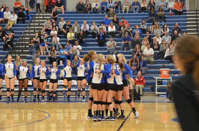 The Royals celebrate win after the final point against Orono, ending the third set 25-11.