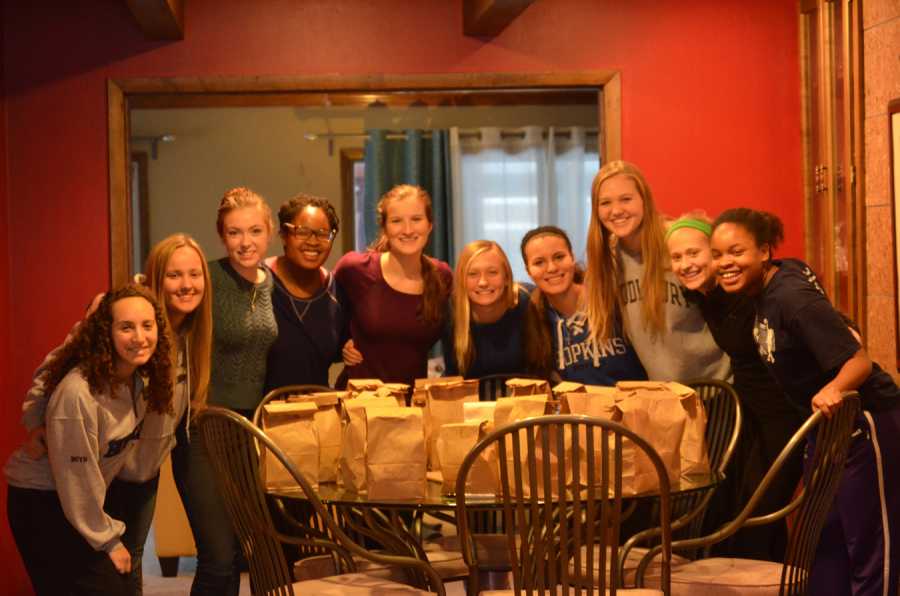 Project Focus members Alexis Dorfman, Katie Dorsher, Maria Davidson, Trianna Downing, Nika Hadley, Grace ONeil, Sophie Boerboom, Ellie Maag, Lindsay Novak, and Morgan Downing pose in front of the 30 lunches they prepared.