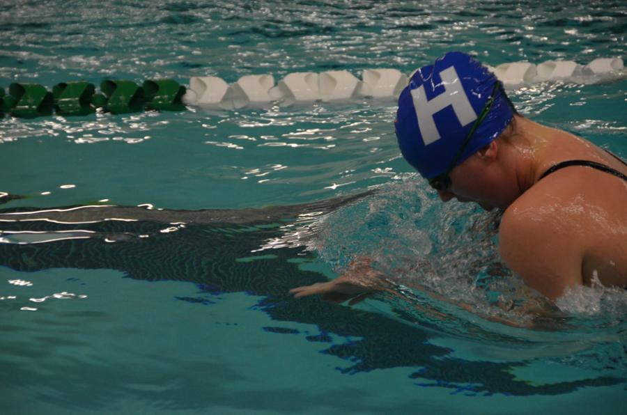 Cassidy Coats swimming the 100 breath stroke.
