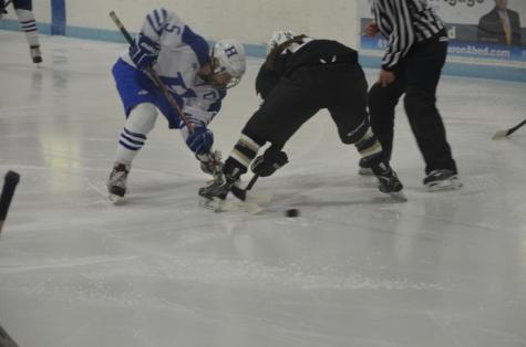 Corbin Boyd, senior, battling for the puck during a face-off in Thursday's.