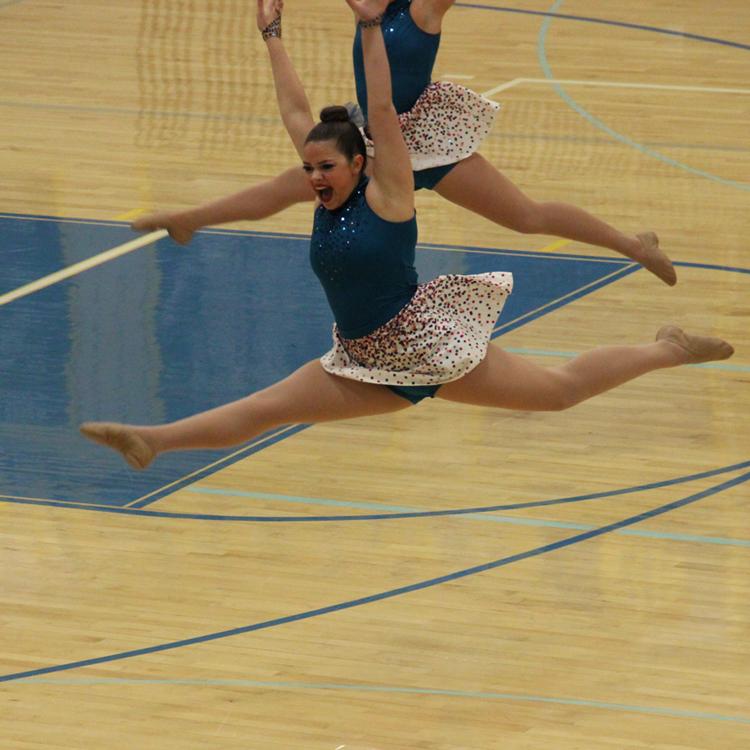 Zoe Mosow, senior, leaps during the choreographed performance of I Wont Give Up.