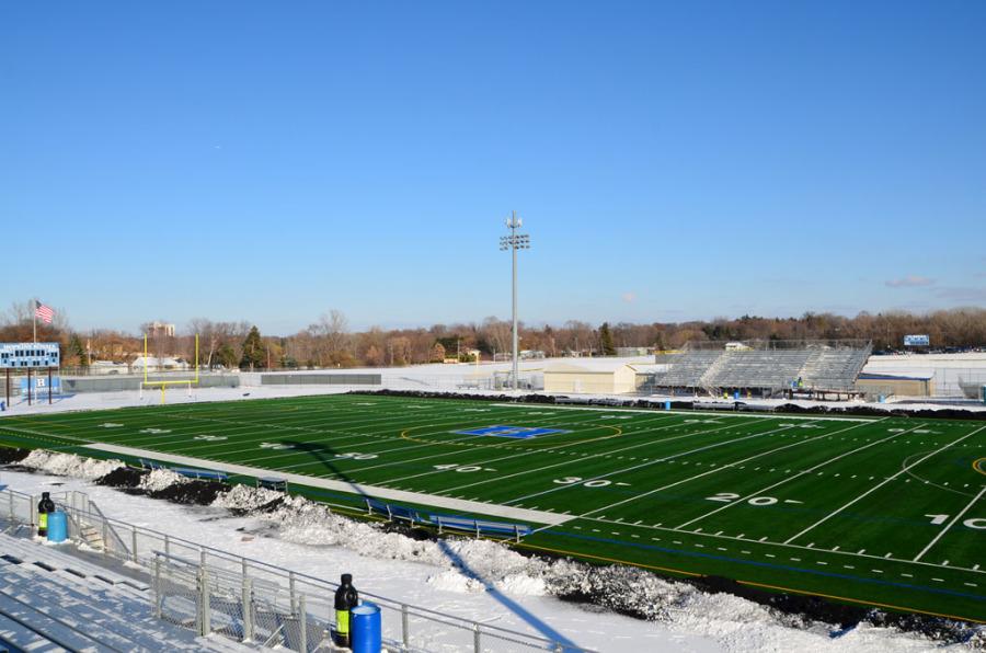 The bleachers overlook a newly shoveled field. Volunteers spent hours clearing snow in cold temperatures for the state football game.