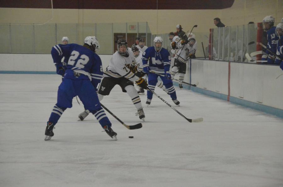 Riley Martin, junior, handles the puck during Tuesdays 4-0 win over Apple Valley.