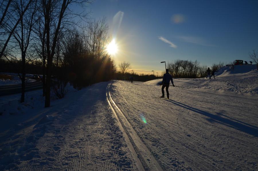 A skier tests out the race course before the start. The conference relays were held at Elm Creek.