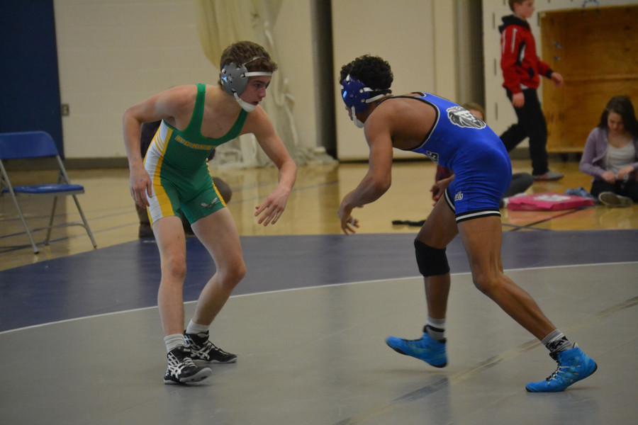 Nathaniel Johnson, sophomore, gets in position to take down his opponent.