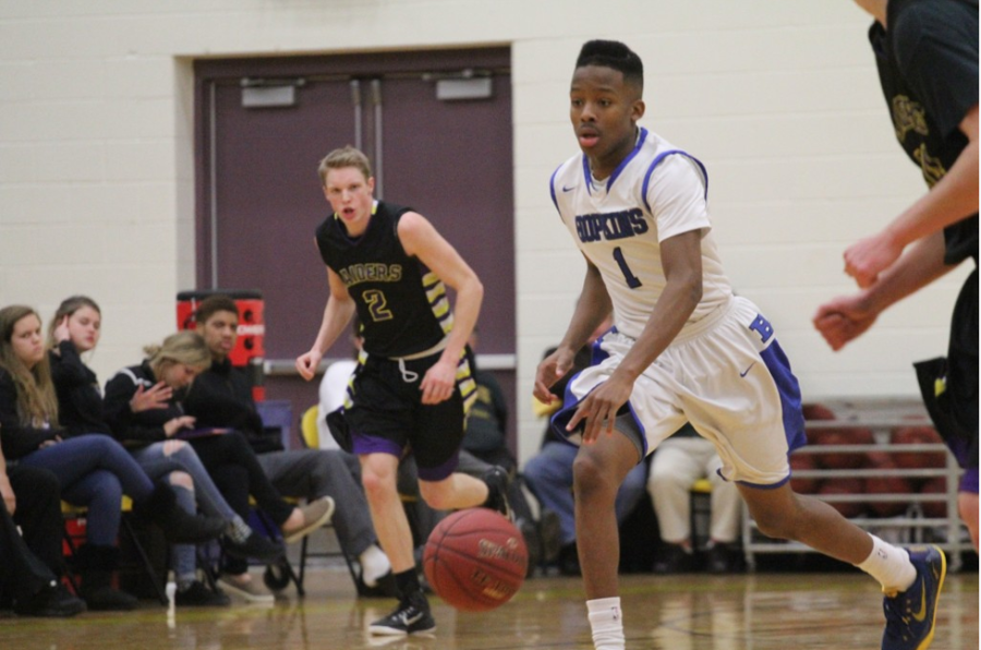 Xavier Johnson, junior, pushes the ball up the floor in the Royals 72-64 win over Cretin Derham Hall. 