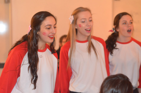 Orielle Heilicher, Maddie Pope, and Lilly Shapiro, juniors, sing with their group, Fedori.