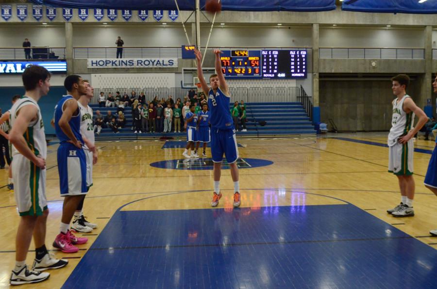 Simon Wright, senior,  shoots a free throw at Hoops for Hope fundraiser.