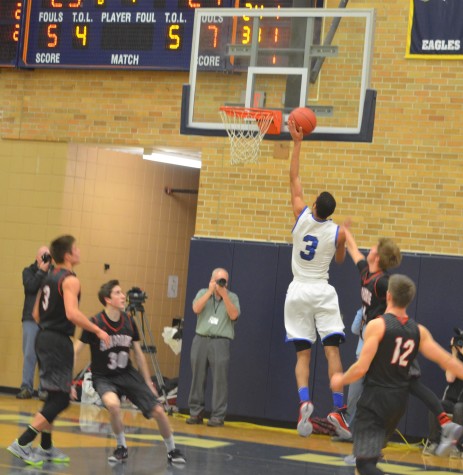 John Warren, senior, goes up for a lay-up in the Royals' 59-58 win over Eden Prairie in the Section 6AAAA championship game.