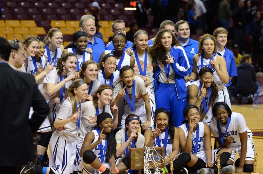 The HHS girls basketball team poses after the state championship win.