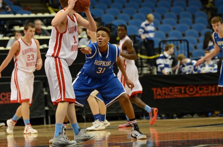 Ishmael El-Amin, sophomore, plays defense in the state quarterfinal game against Lakeville North.
