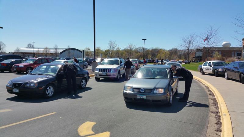 Minnetonka Police Officers stop students on their way out of the parking lot. 