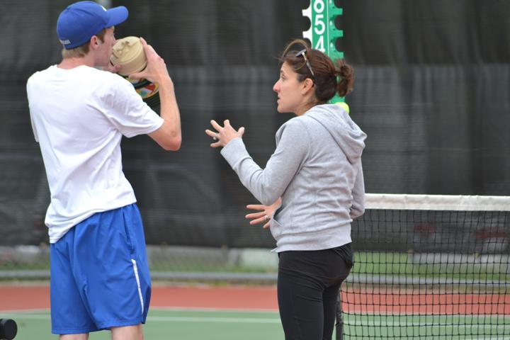 Ali King, coaching the boys varsity team. King was a star for the HHS girls tennis from 1990-1996.
