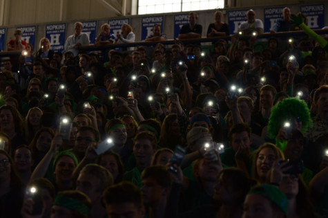 All across the stands, students shine their phone lights while Jasmine Dickerson, senior, sings at the 2015 fall Pepfest.