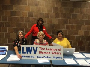 Members of the League of Women Voters support students registering to vote.