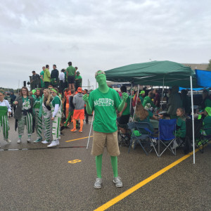 Jack Sweeney, senior, wears a green morph suit to represent his class color. 
