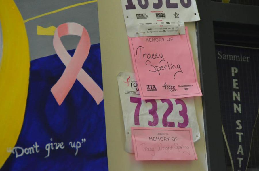 A mural and race bibs hang in the South wing in memory of Tracy Wright-Sperling, former Hopkins teacher.