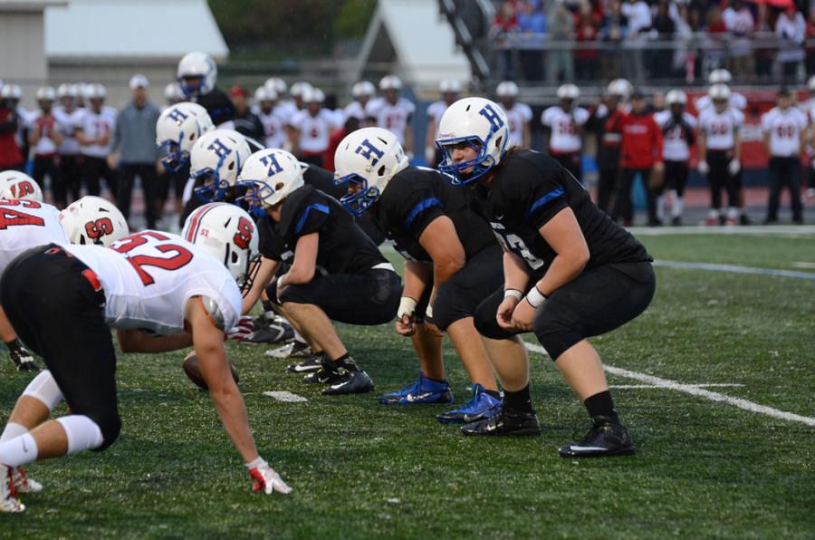 The Royals offensive line prepares for a play against the Shakopee Sabers. The linemen were an integral part of the Royals success this season.