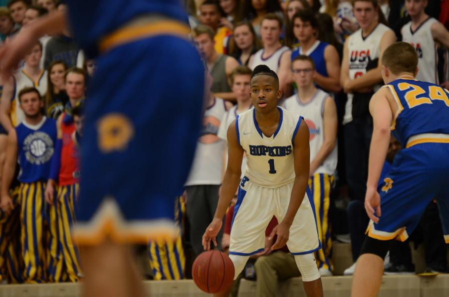 Xavier Johnson, senior, looks for a pass in the game against the Wayzata Trojans.