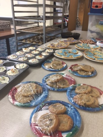 Krattley and volunteers create over 100 treats to sell for their trip