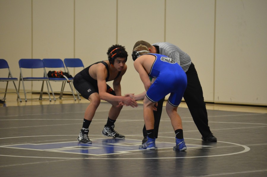 Justin Grunseth, junior, shakes before a match in the 2014-15 season.