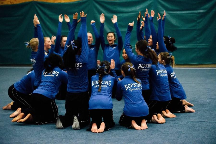 Gymnastics team cheers in preparation of  their first meet of the season against Eden Prairie