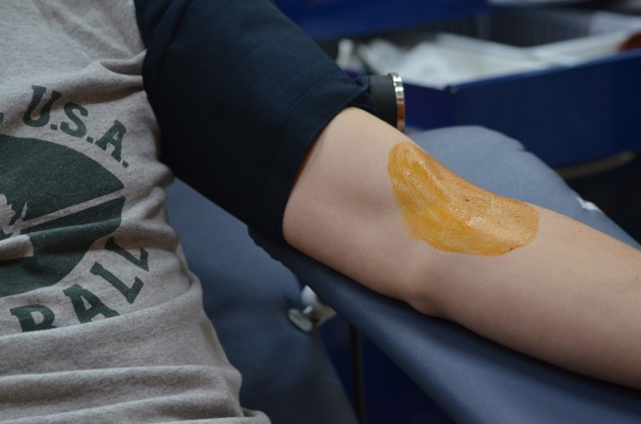 A student gives blood at the Memorial Blood Drive on Wednesday, Feb. 24, 2016.