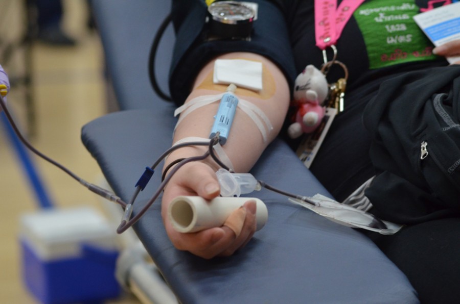 A student gives blood at the Memorial Blood Drive on Wednesday, Feb. 24, 2016.