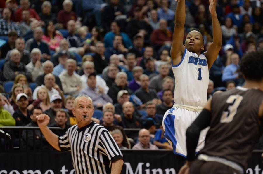 Xavier Johnson, senior, shoots a three pointer in the semifinal state game against the Apple Valley Eagles.