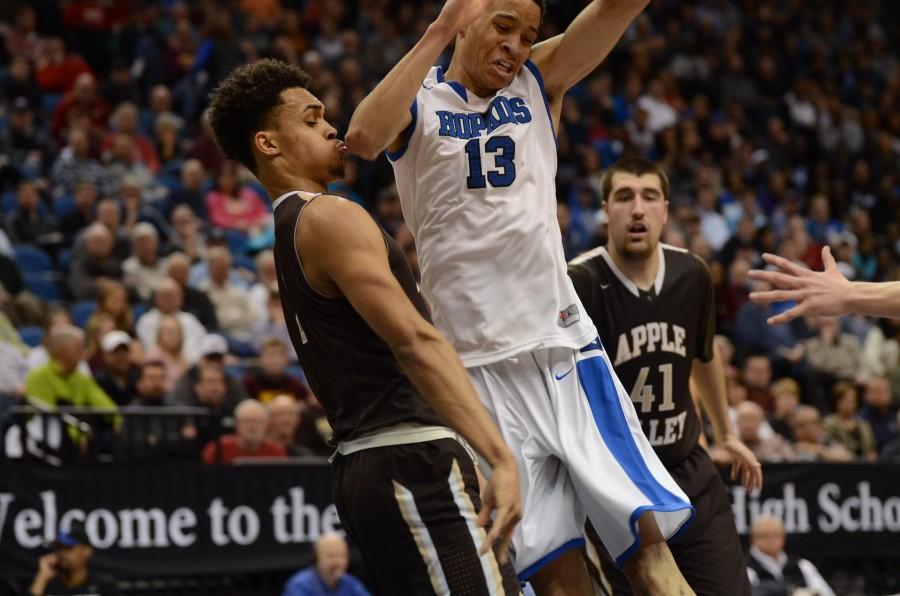 Amir Coffey, senior, goes in for a layup in the semifinal state game against Apple Valley.