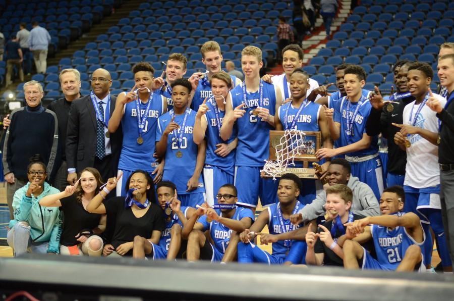 The HHS boys basketball team poses after their state championship win.