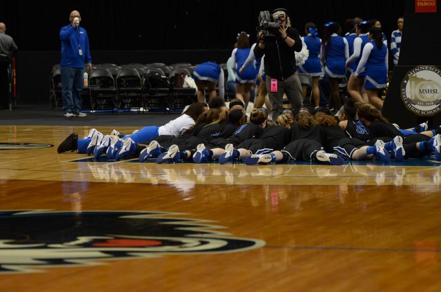 The HHS girls basketball team huddles up before the quarterfinal state game.