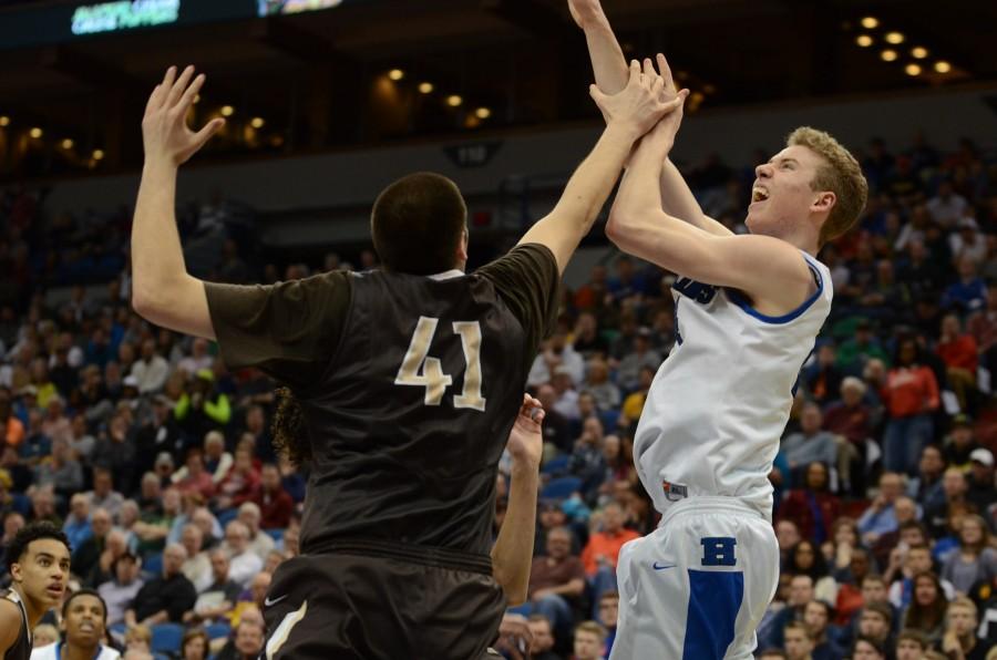 Erik Davis, senior, goes in for a shot during the semifinal state game against Apple Valley.