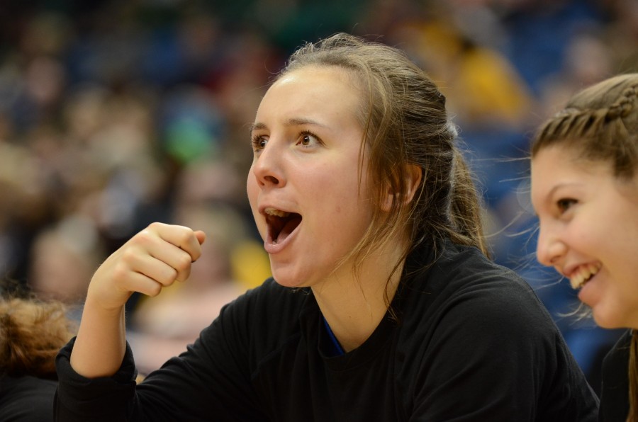 Julia Jallo, senior, cheers her teammates on during the quarterfinal state game.