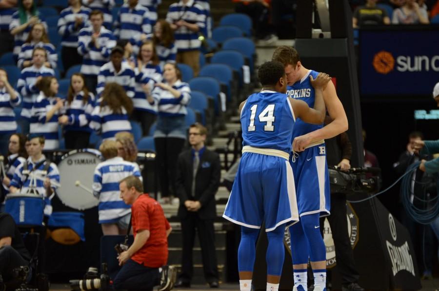 Vinnie Shahid, senior, and Simon Wright, junior, talk before the AAAA state final game.