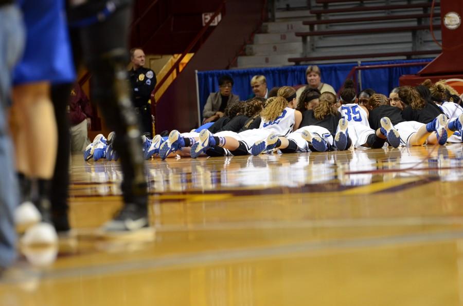 The HHS girls basketball team pumps up for the semifinal state game.