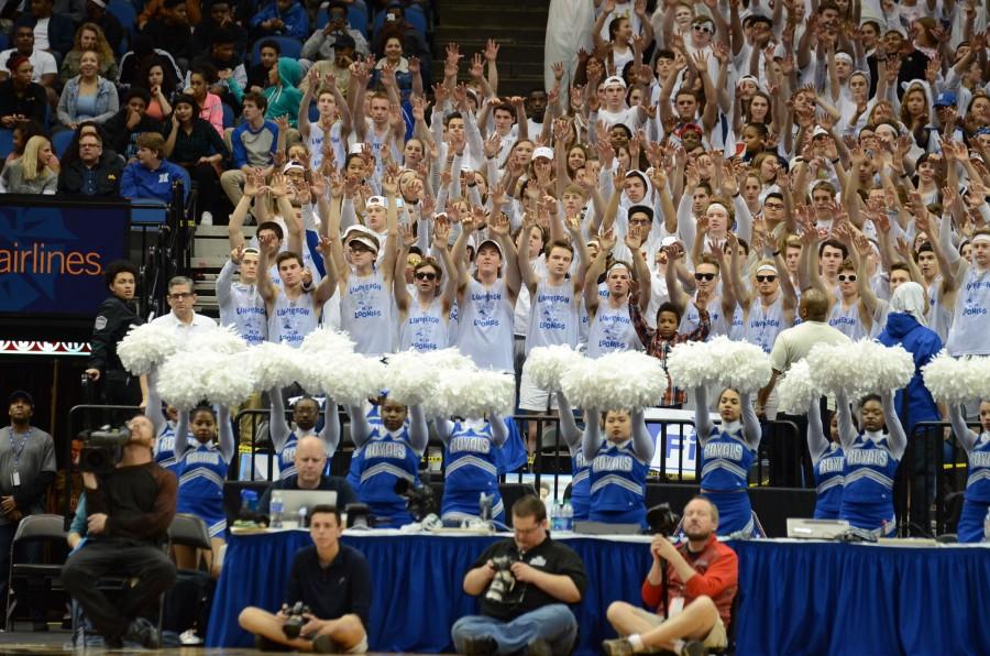 The HHS fans cheer for the boys basketball team during a free throw in the AAAA state final game.