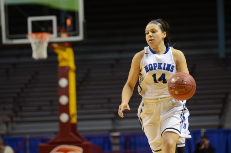 Ashley Bates, senior, dribbles the ball down the court in the semifinal state game.