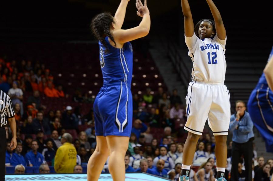 Nia Hollie, senior, shoots a three pointer in the semifinal state game.