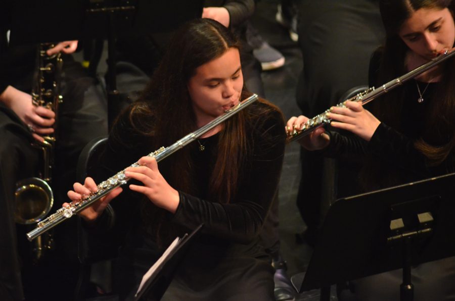 Kristen Ho, sophomore, plays the flute in the spring band concert.