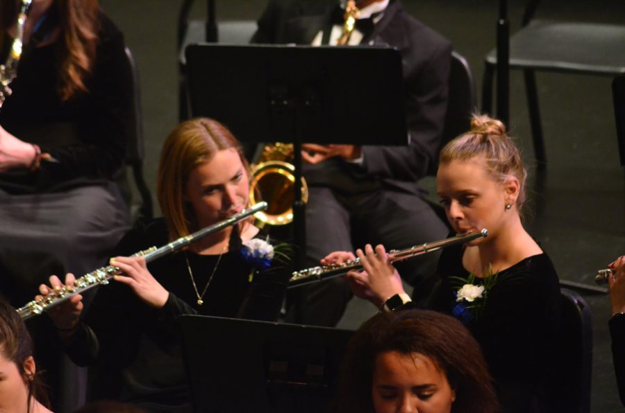 Addie Sedoff and Megan Anderson, seniors, play the flute.