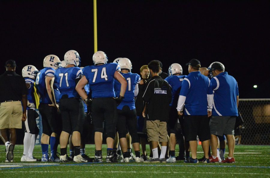 Royals huddle up for game plan against Maple Grove. 