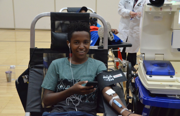 Jonathan Goins, junior, prepares to have his blood taken at the blood drive.