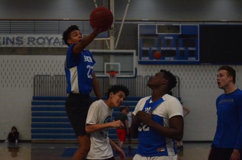 Ishmael El-Amin, senior, goes in for a basket during tryouts for the 2016-2017 basketball season.