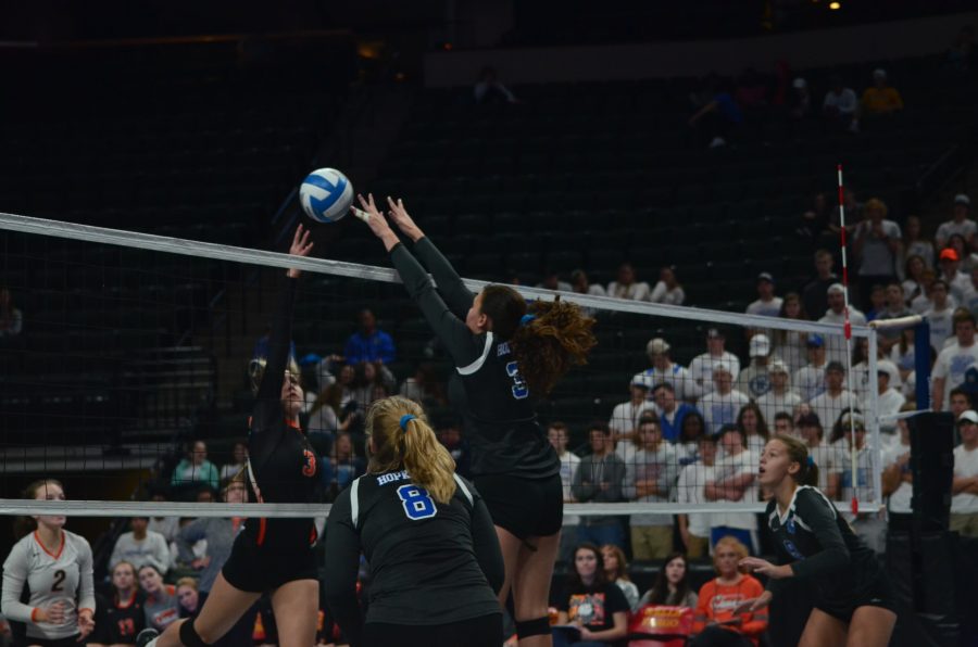 Jane Nelson, senior, hits the ball during the first state volleyball game.