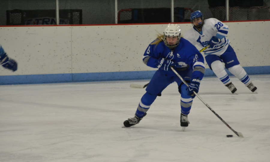 Kylie Hanley, junior, takes the puck down the ice in the 7-0 win over Bloomington Jefferson. Hanley finished with a Hat Trick
