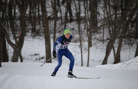 Logan Hoffman, junior, skis through meet. This picture was taken at the conference meet.  