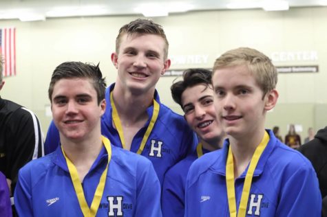 The 200 medley relay of David Lorentz, junior, Avery Martens-Goldman, junior, Elliot Berman, NJH eighth grader, and Avi Bundt, junior, receives their fourth-place medals at the section 6AA meet.