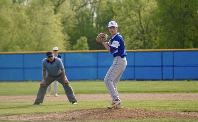 Matt Shaw, senior, winds up to deliver a pitch